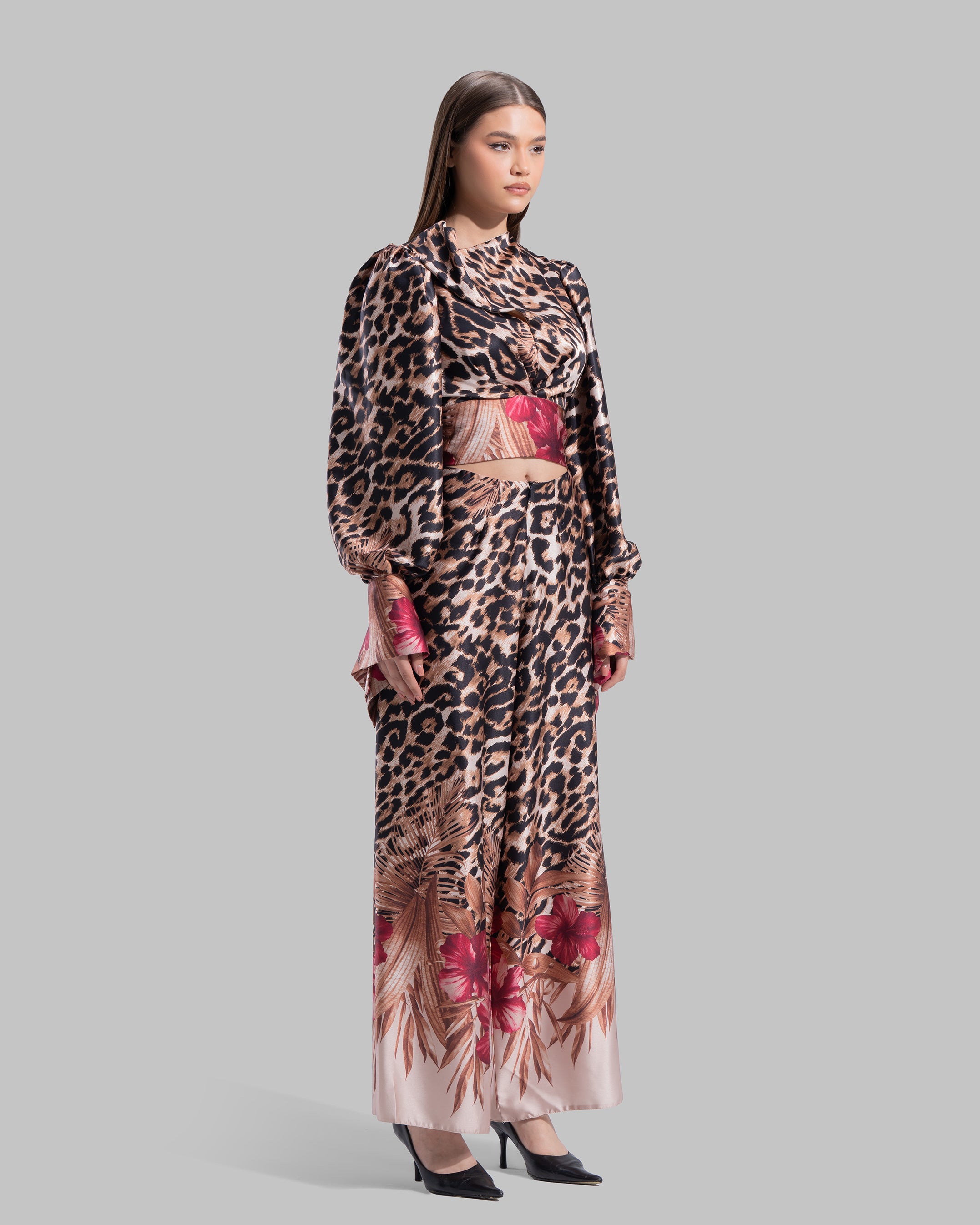 Long sleeve top with a draped neckline and slightly puffed shoulders.