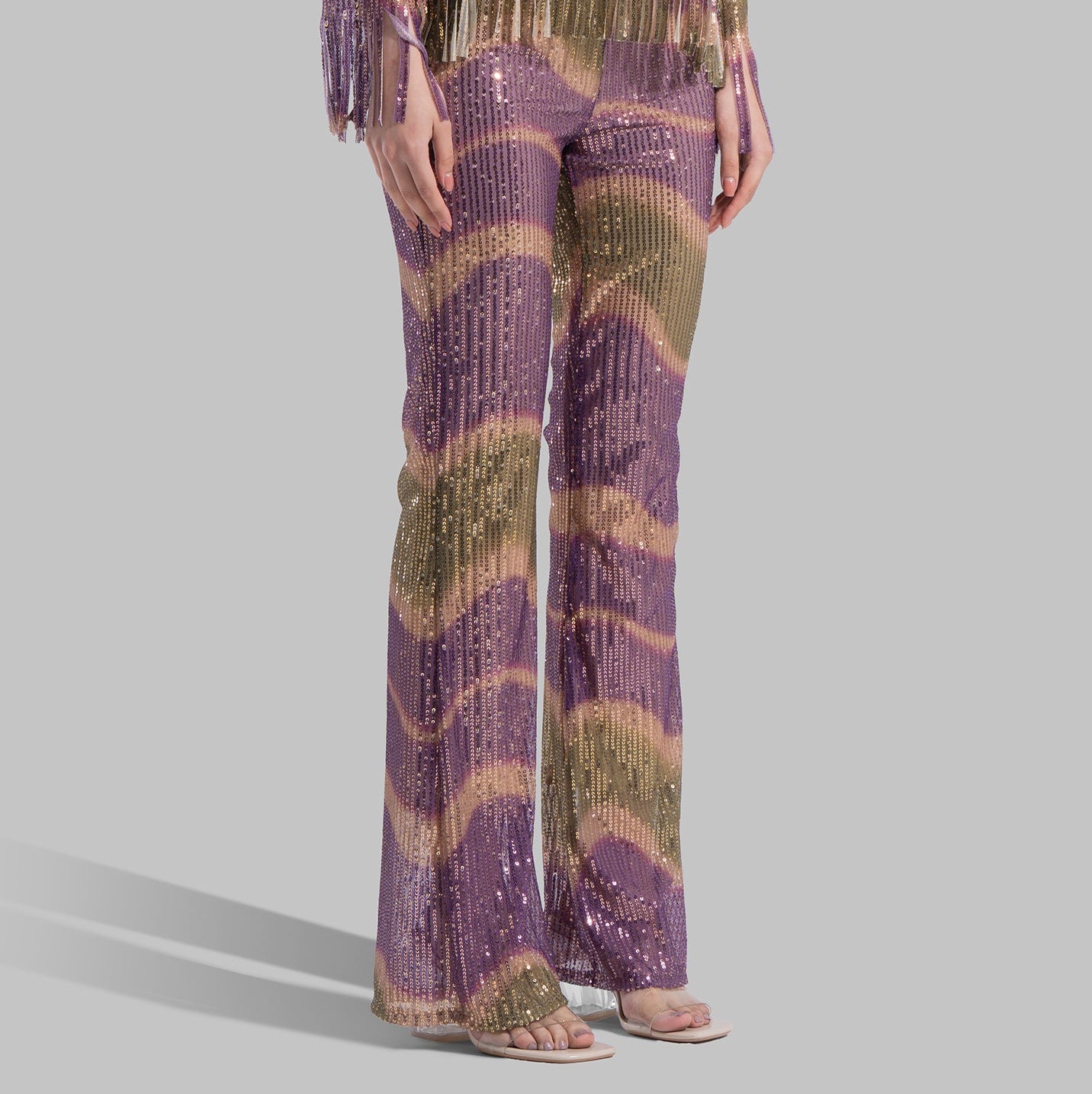 High-waisted Flared Leg trousers with an elastic waistband.