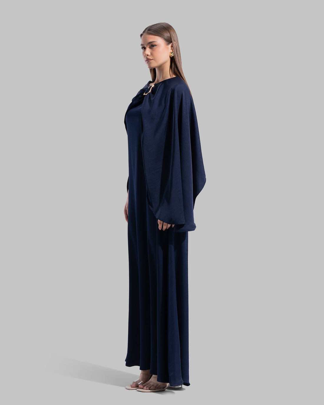 Long dress made of a flowing satin-finish fabric.