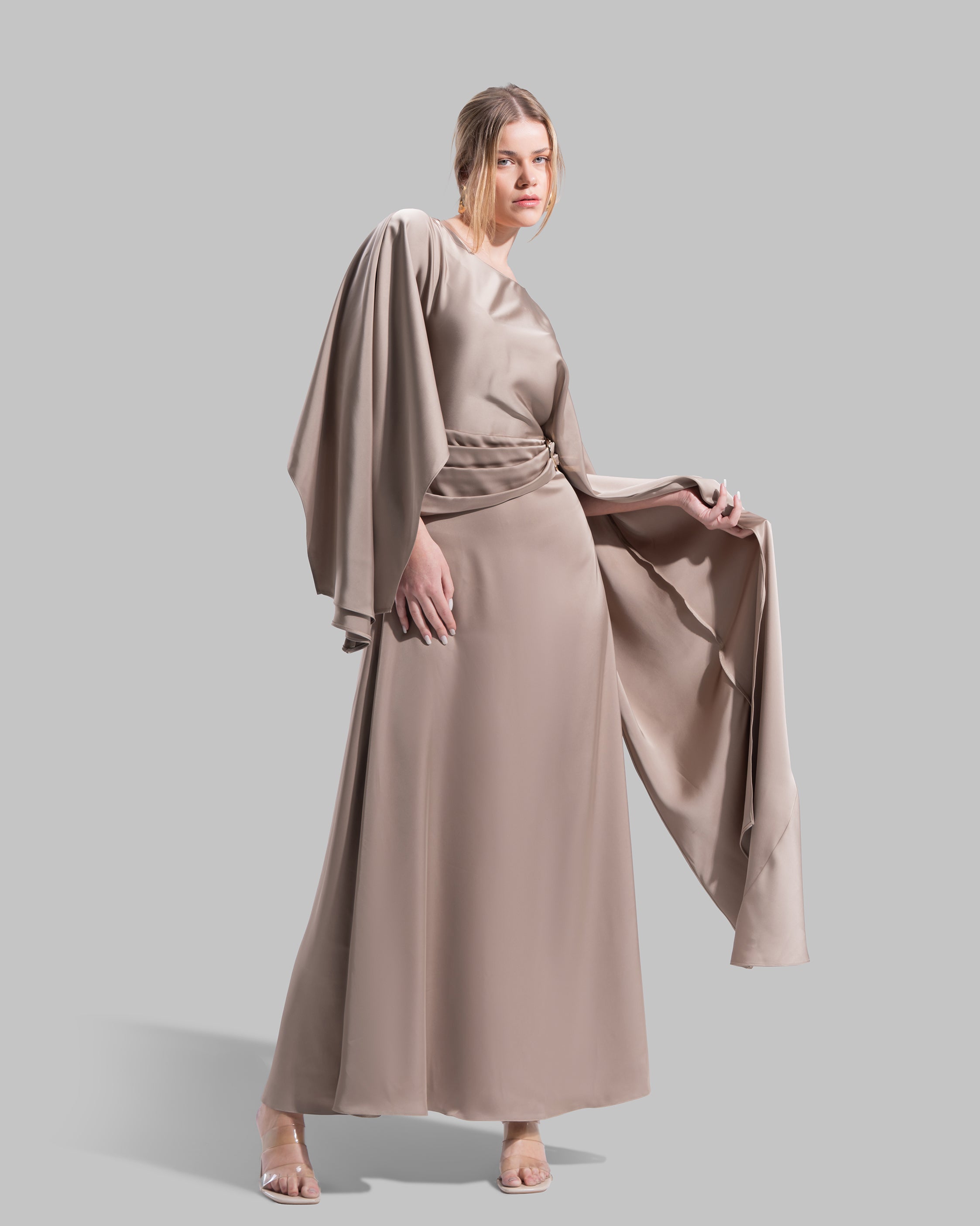 An elegant satin gown of sweeping length