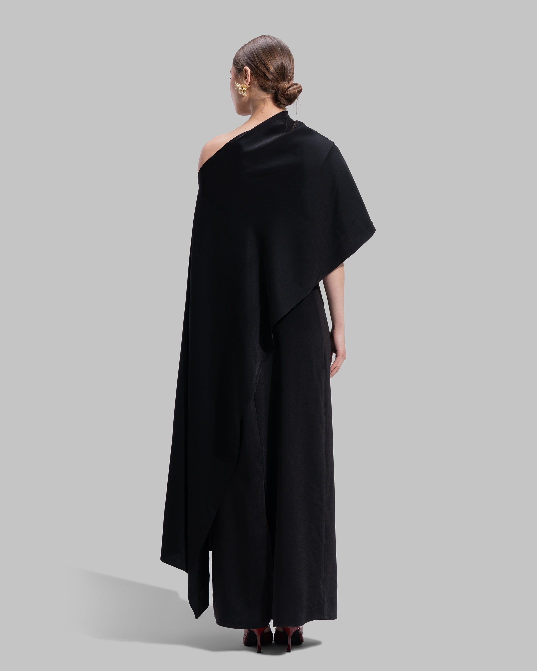 Draped asymmetrical neckline satin maxi dress with a fluid oversized silhouette.