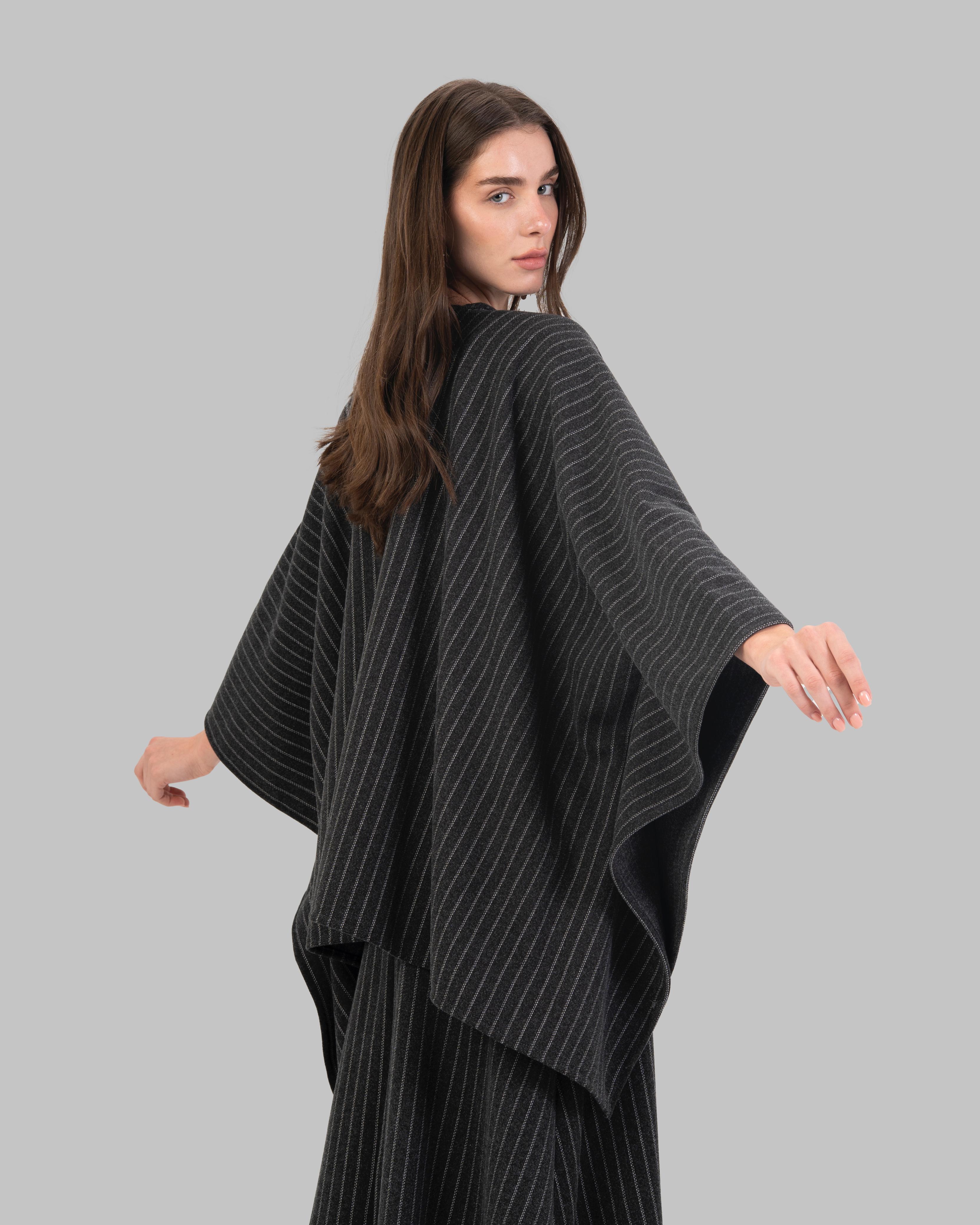 pinstripe poncho with a V-neck and an asymmetric hem.