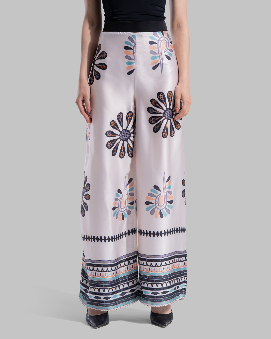 High-waist wide-leg pants with elastic waistband and Boho Sunburst graphic print.
