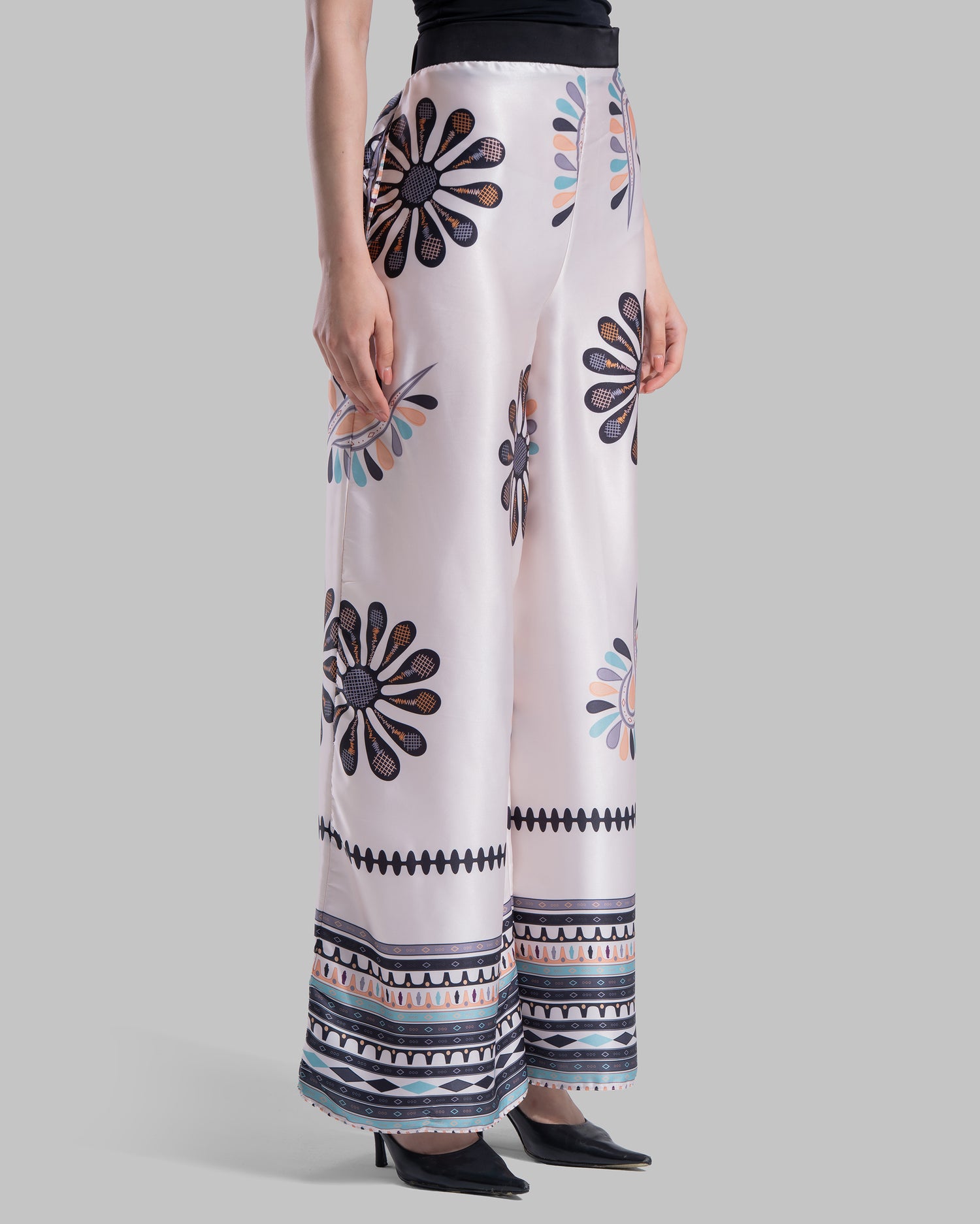 High-waist wide-leg pants with elastic waistband and Boho Sunburst graphic print.