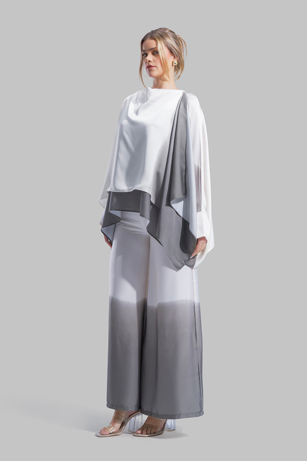 Draped asymmetrical blouse with a side-split design.