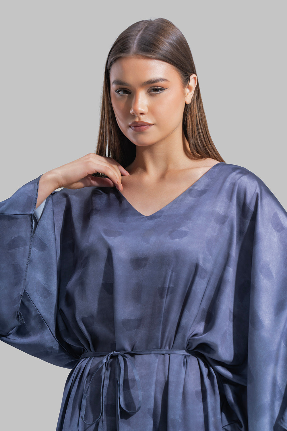 Oversized maxi dress featuring a V-neckline and wide kimono-style sleeves.