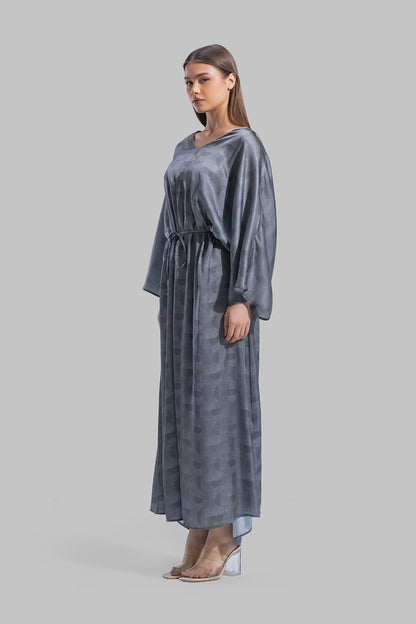 Oversized maxi dress featuring a V-neckline and wide kimono-style sleeves.