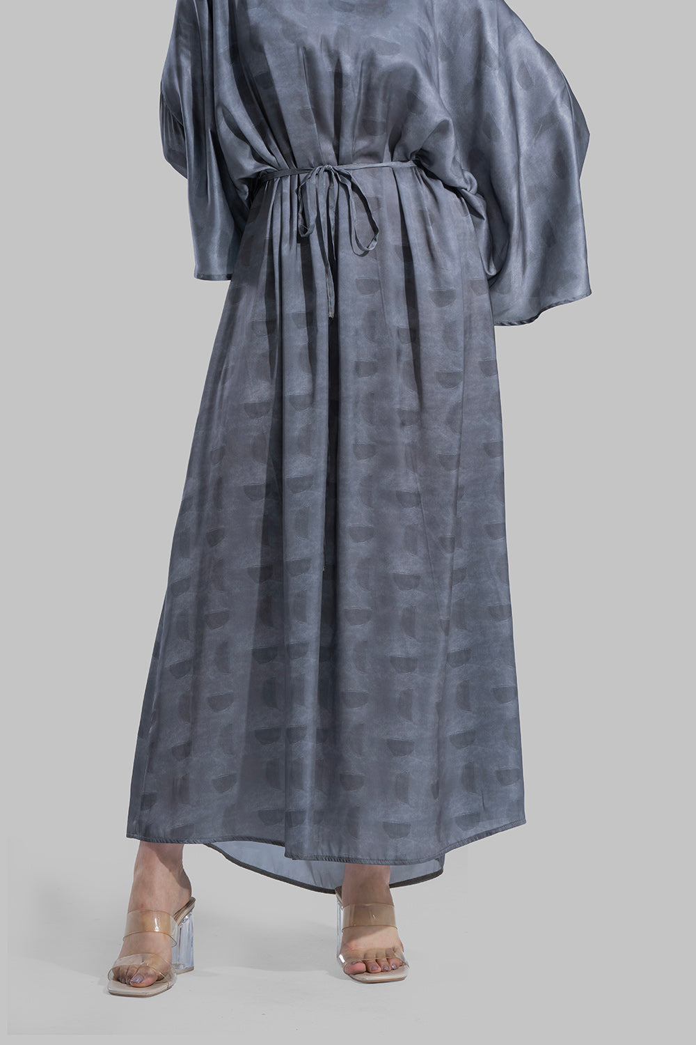 Oversized maxi dress featuring a V-neckline and wide kimono-style sleeves.