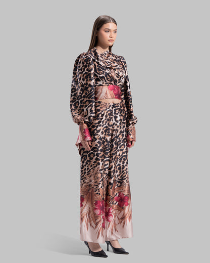 Long sleeve top with a draped neckline and slightly puffed shoulders.