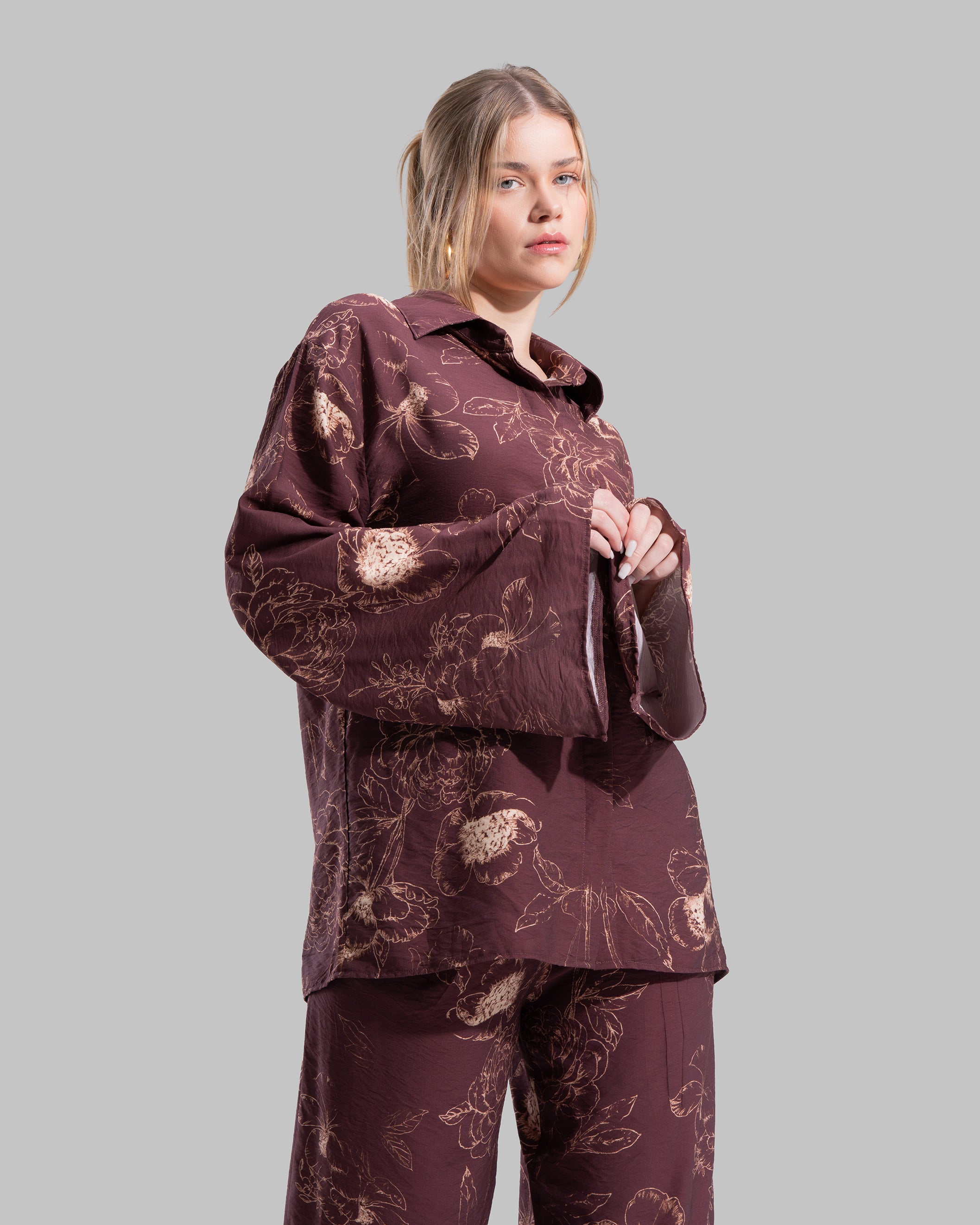 Oversized floral print blouse with a classic collar and long sleeves.