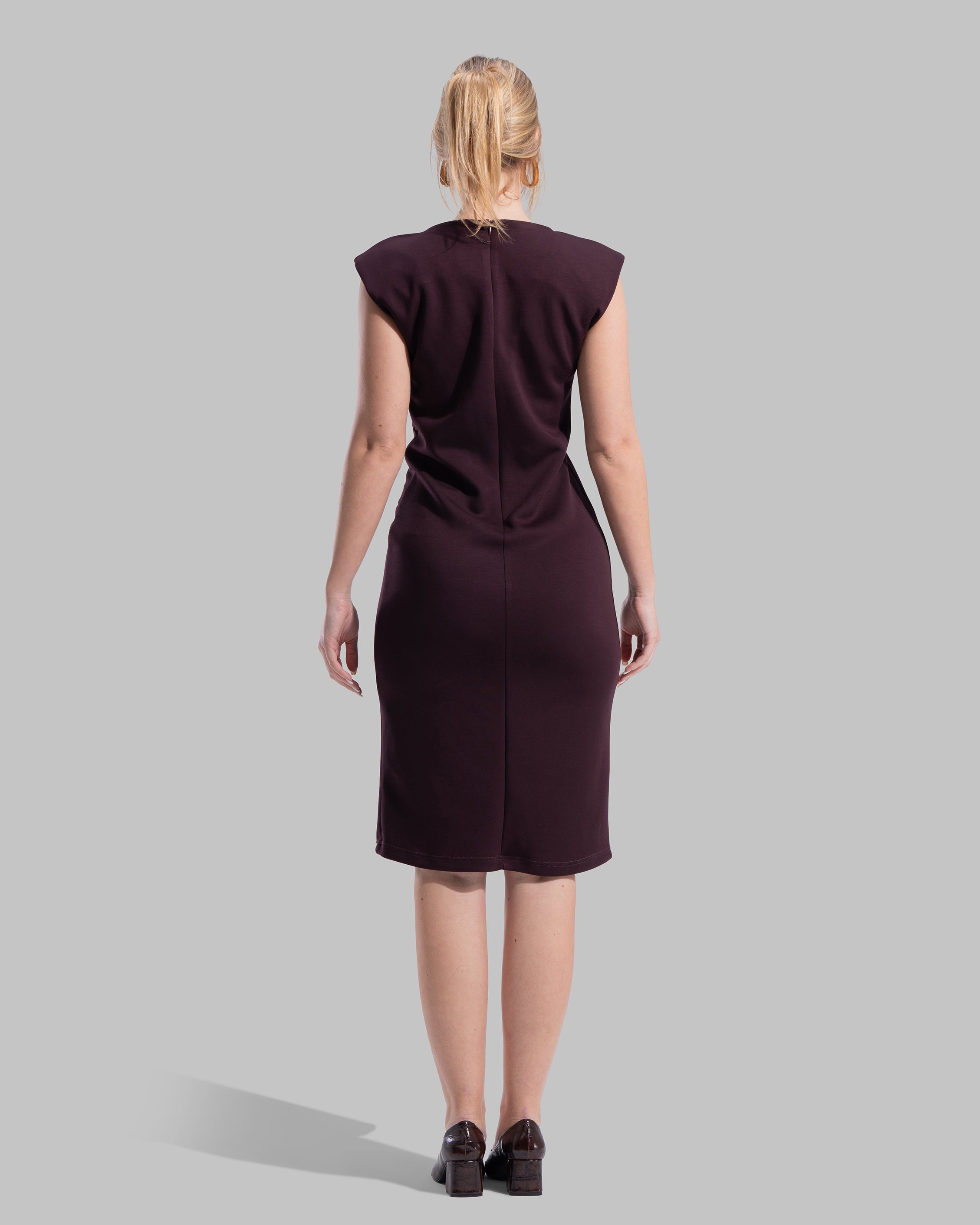Sleeveless midi dress featuring a round neckline and front draped knot detail.