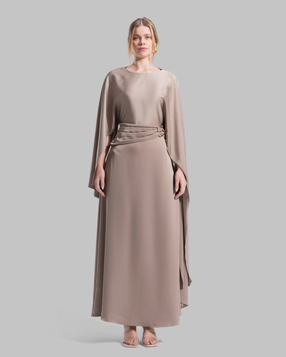 An elegant satin gown of sweeping length