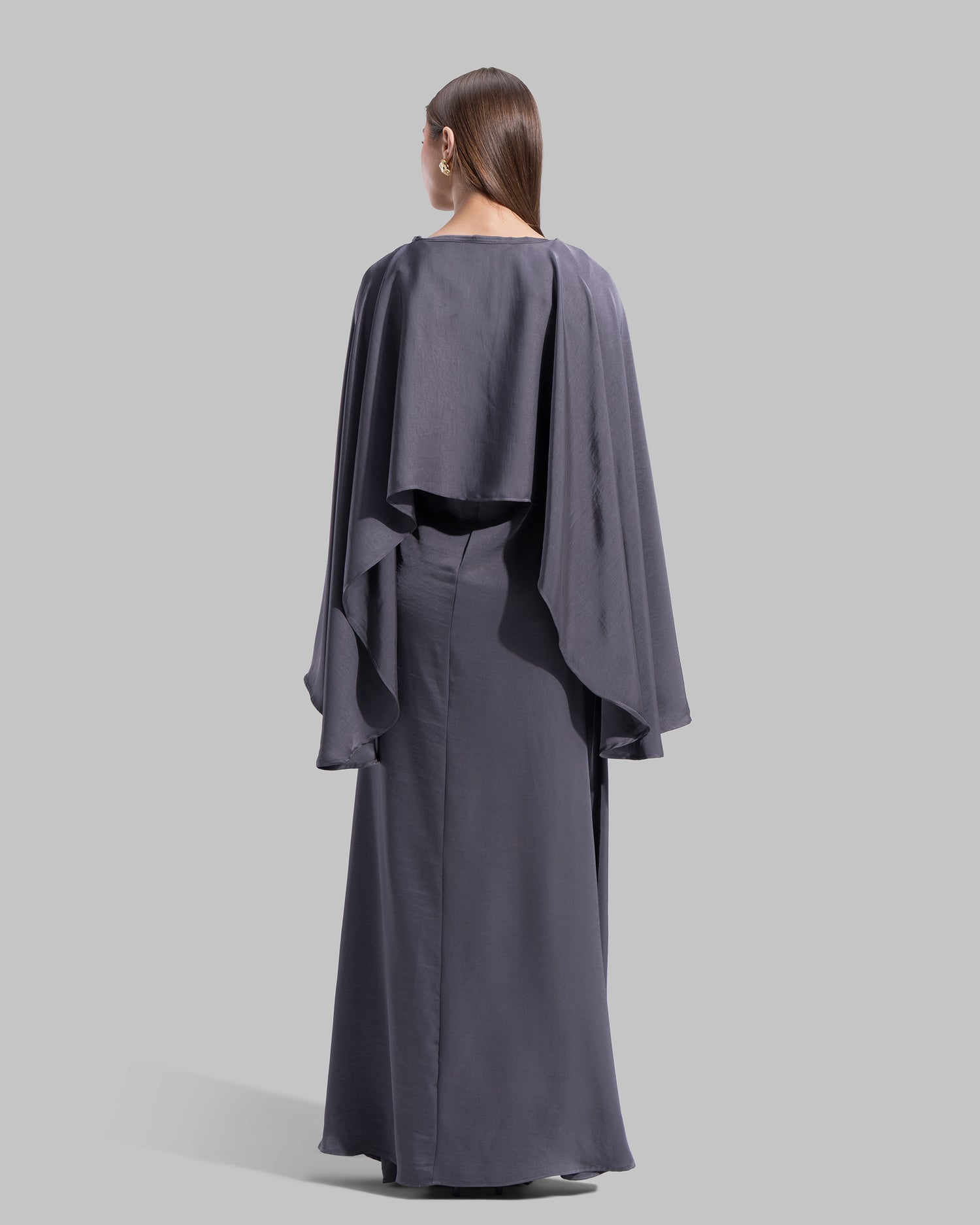 Long dress made of a flowing satin-finish fabric.