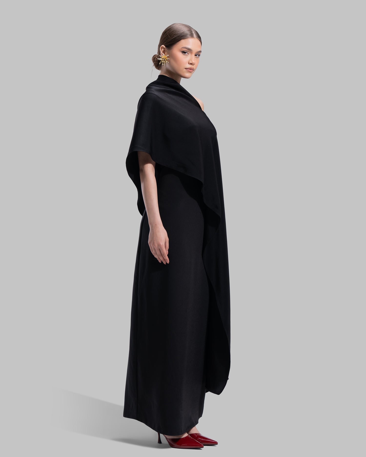 Draped asymmetrical neckline satin maxi dress with a fluid oversized silhouette.