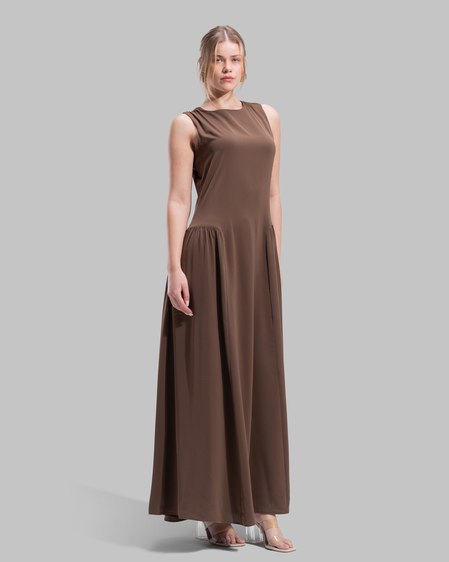 Sleeveless long dress with a round neckline.
