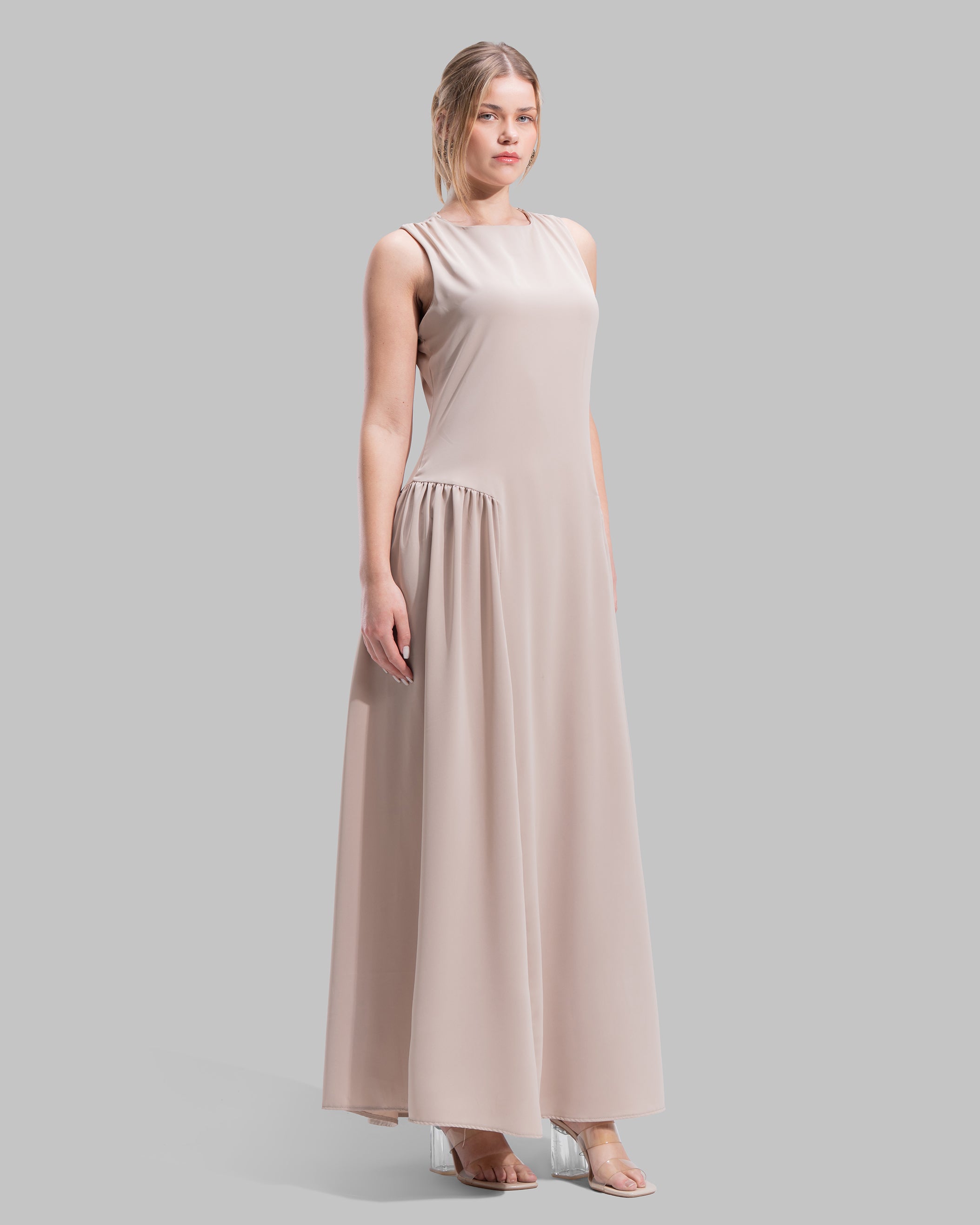 Sleeveless long dress with a round neckline.