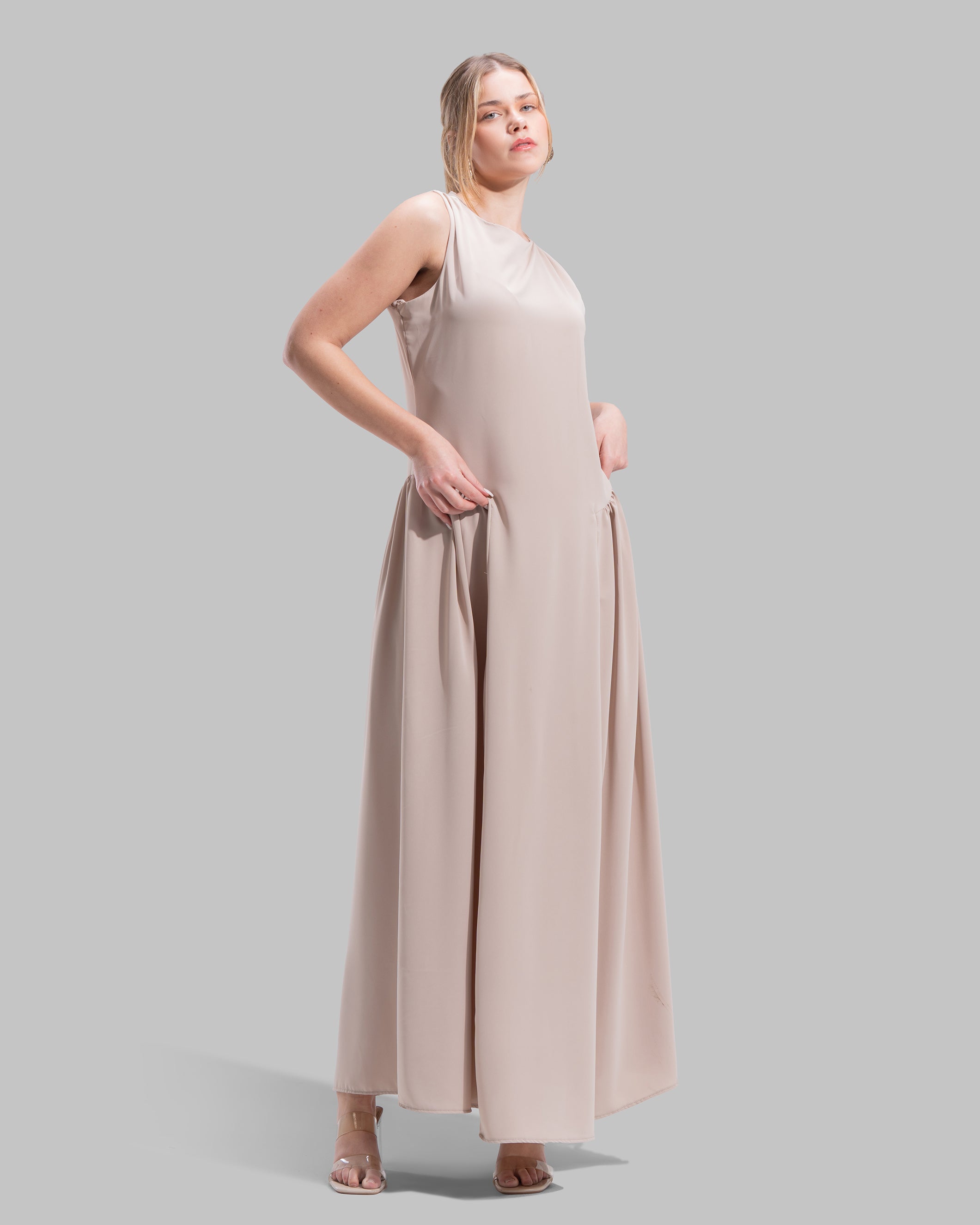 Sleeveless long dress with a round neckline.