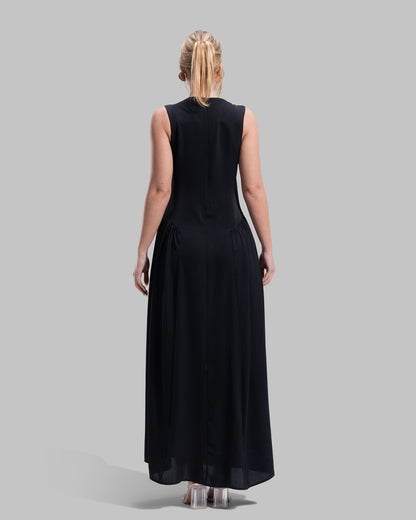Sleeveless long dress with a round neckline.
