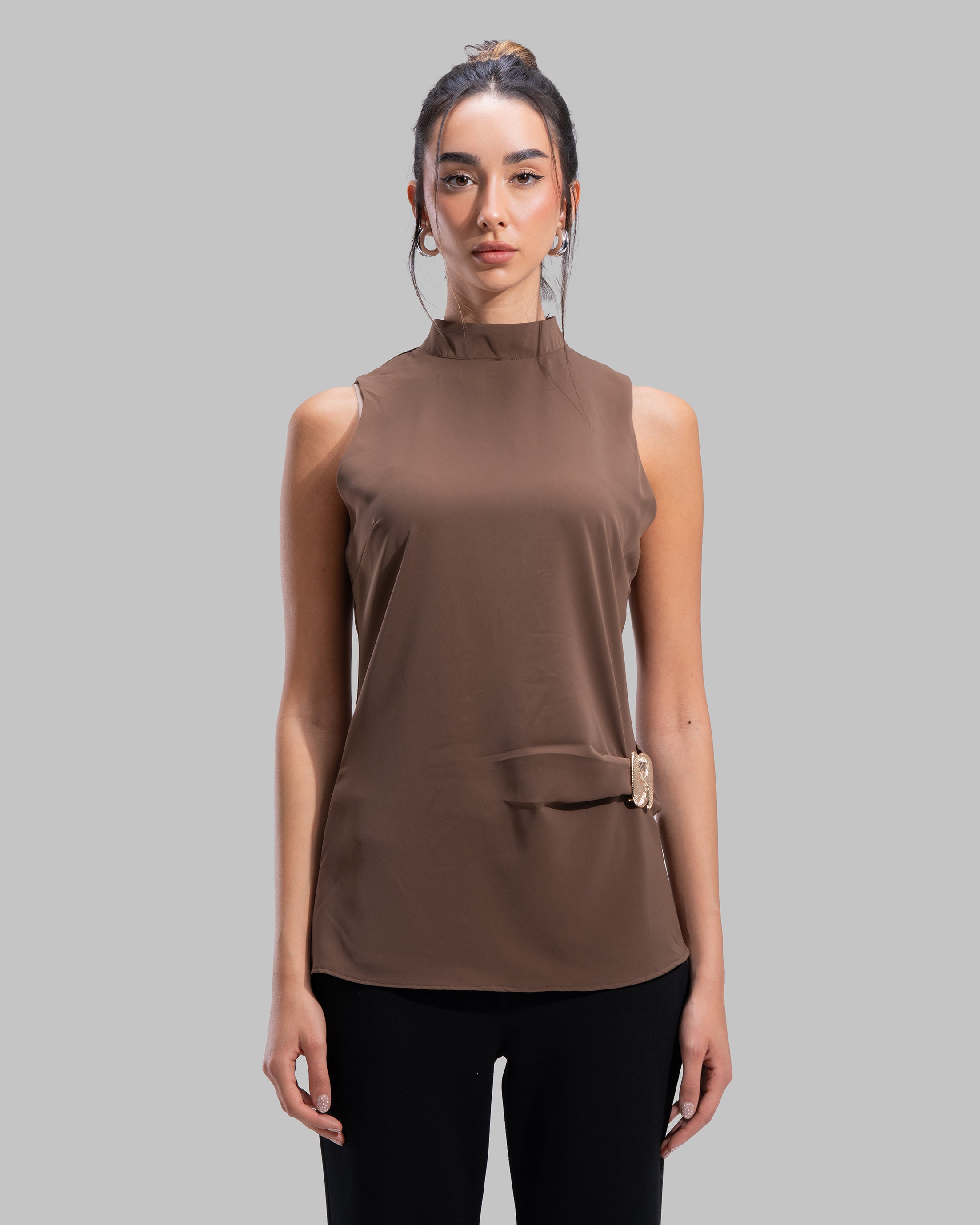 Sleeveless high-neck top with gathered detail and a metallic side buckle.