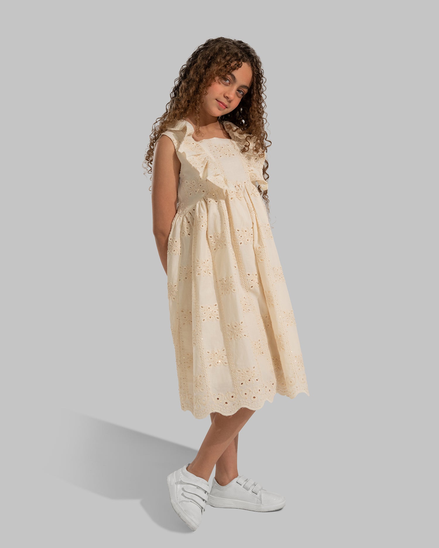 Embroidered sleeveless dress with a square neckline and ruffle details on the straps