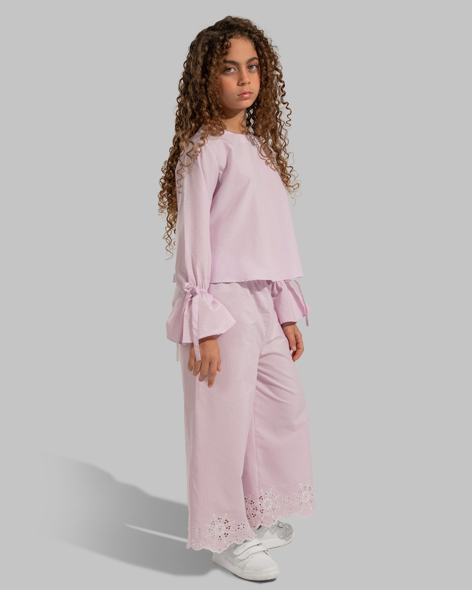 Striped cropped top with bow-detail flare sleeves.