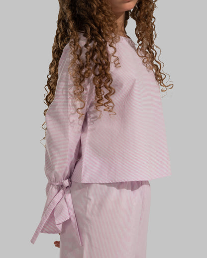 Striped cropped top with bow-detail flare sleeves.