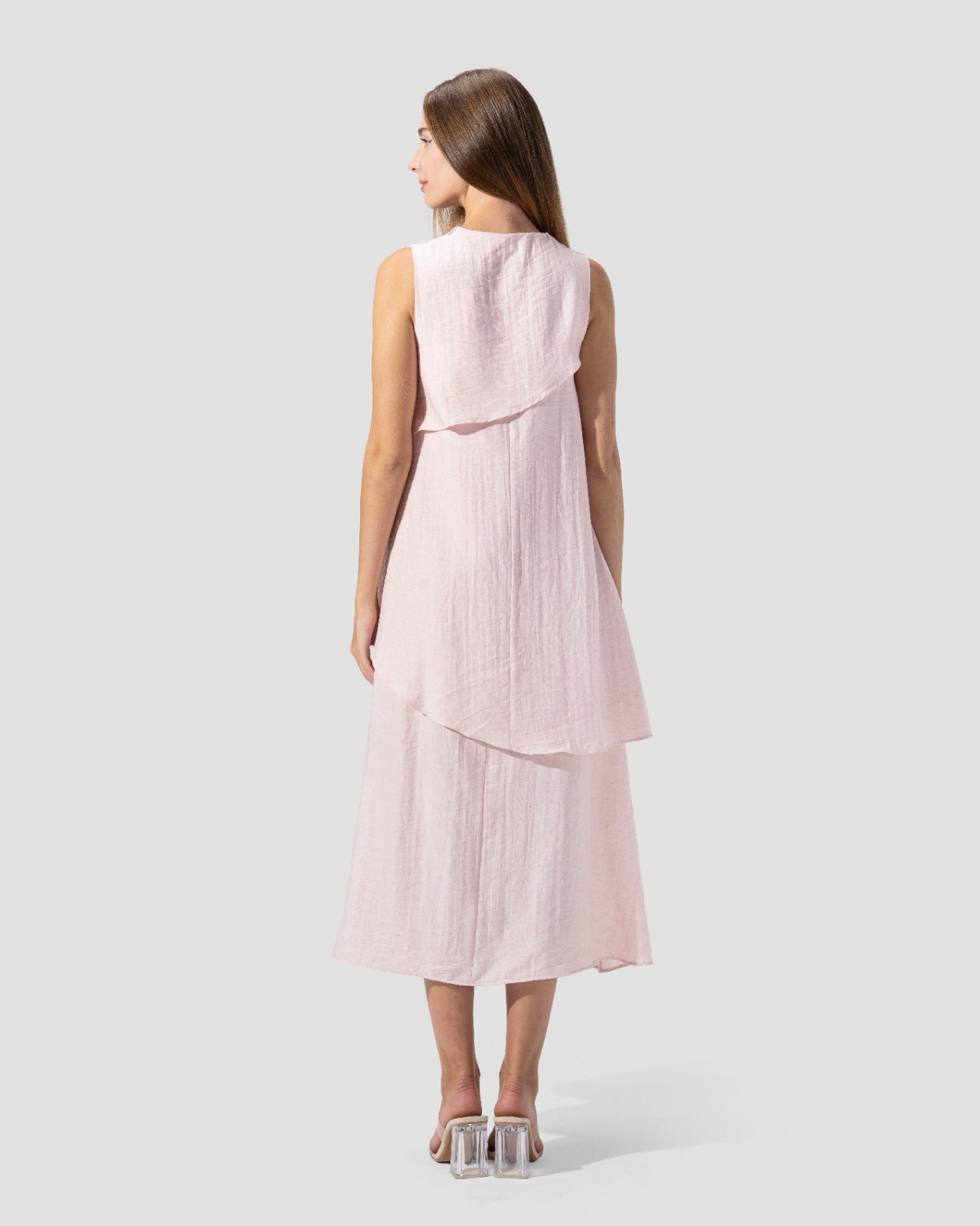 midi dress. round neck and sleeveless with ruffeld hem