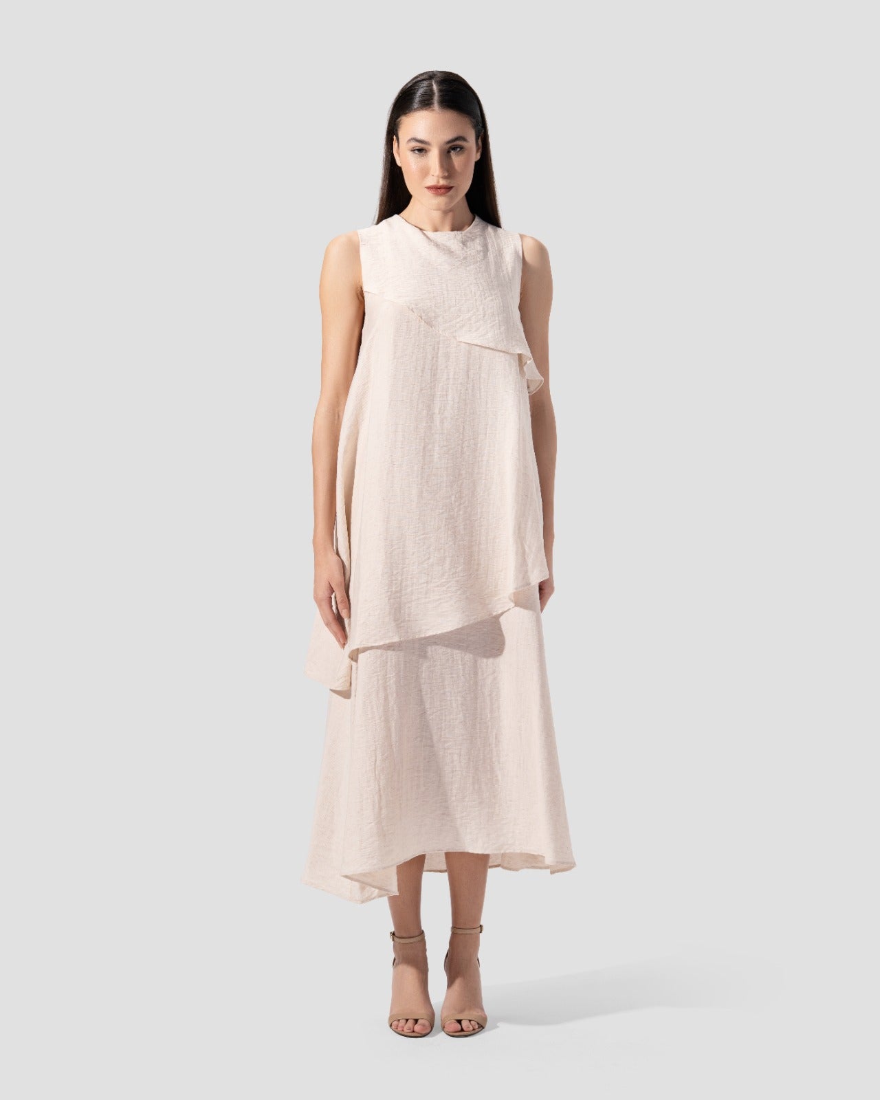 midi dress. round neck and sleeveless with ruffeld hem