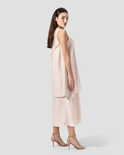 midi dress. round neck and sleeveless with ruffeld hem