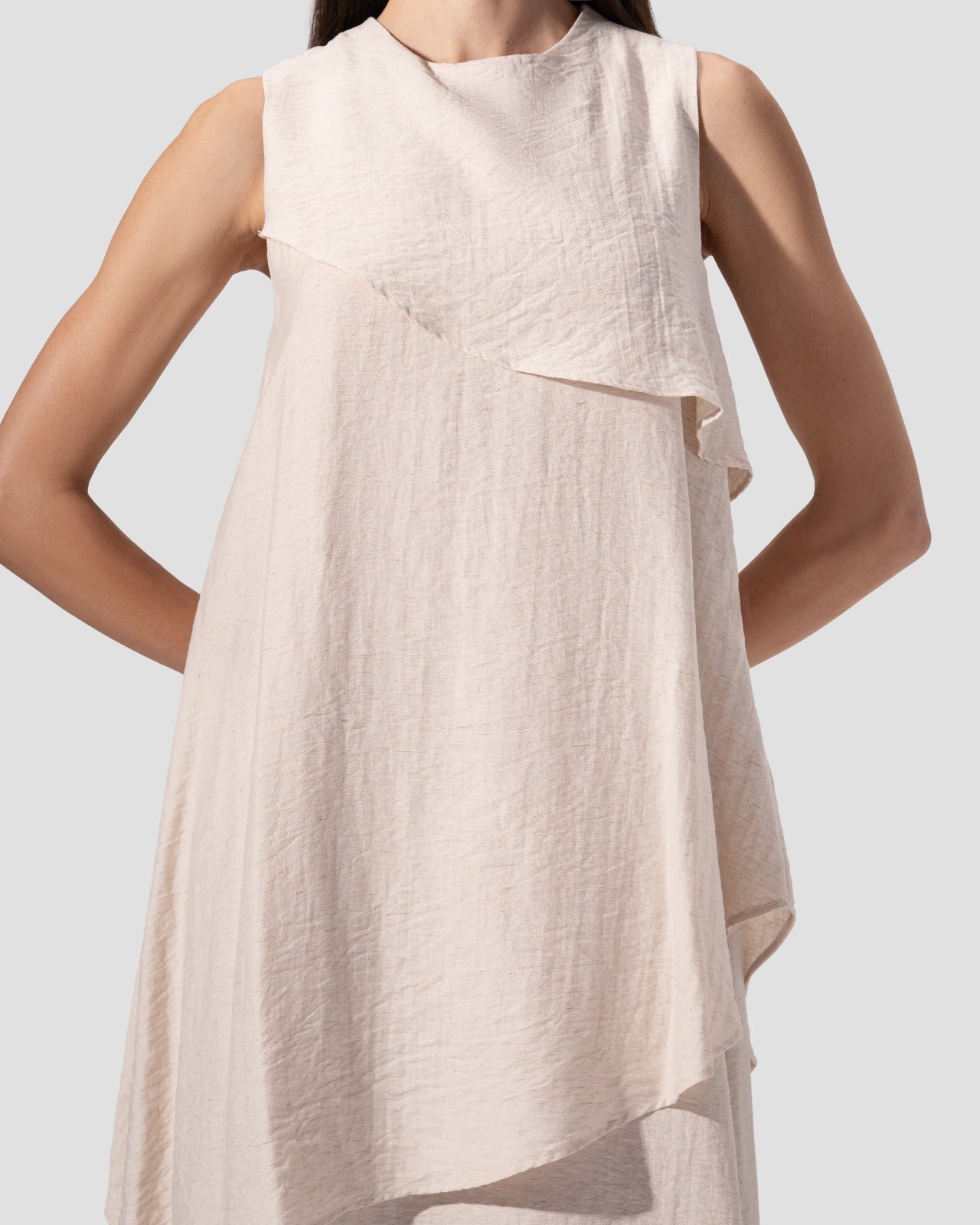 midi dress. round neck and sleeveless with ruffeld hem