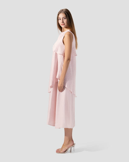 midi dress. round neck and sleeveless with ruffeld hem