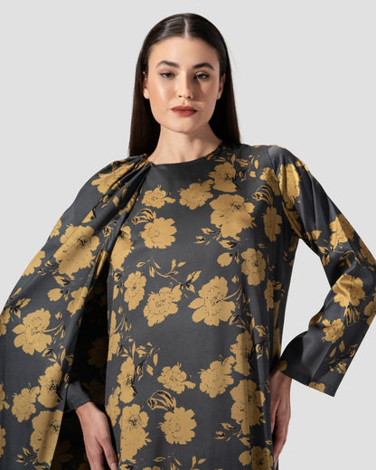 loose dress with a floral print of golden flowers .